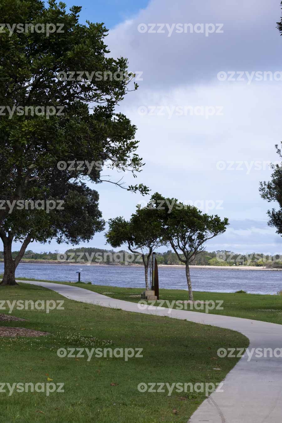 Regatta Reserve walkpath next to Richmond River in Ballina - ID: 221176 Cloudy day at Regatta Reserve, part of the Historic Ballina Riverfront walk in Central Ballina, Northern Rivers Region, New South Wales. Digital & Downloadable Image.