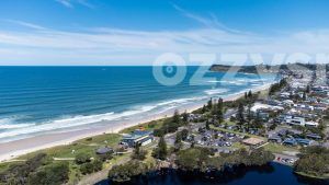 Aerial shot of Lennox Head Coastal area including Lennox Head beach, Seven Mile beach, Pacific Parade, Camp Drewe Road, a section of Lake Ainsworth and Pat Morton Lookout in the background.