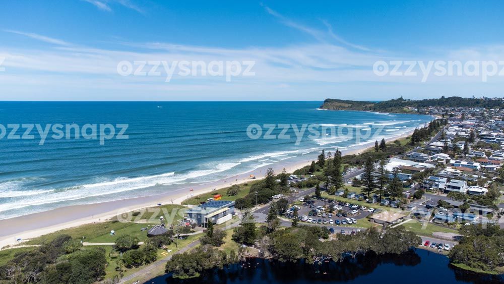 Aerial view of Lennox Head Beach from Lake Ainsworth Aerial shot of Lennox Head Coastal area including Lennox Head beach, Seven Mile beach, Pacific Parade, Camp Drewe Road, a section of Lake Ainsworth and Pat Morton Lookout in the background.