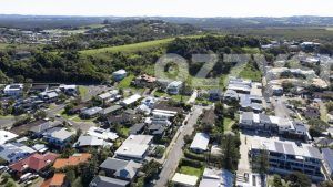 From above, a section of Lennox Head's residential area where you can spot the roundabout at the intersection of Ballina Street with Allens Parade, Rutheford Street, and the turn onto Park Lane.