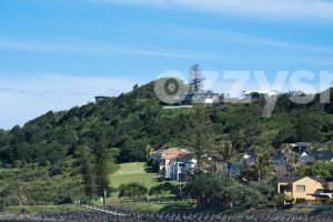 Lennox Point walking path with houses on a hilly horizon.