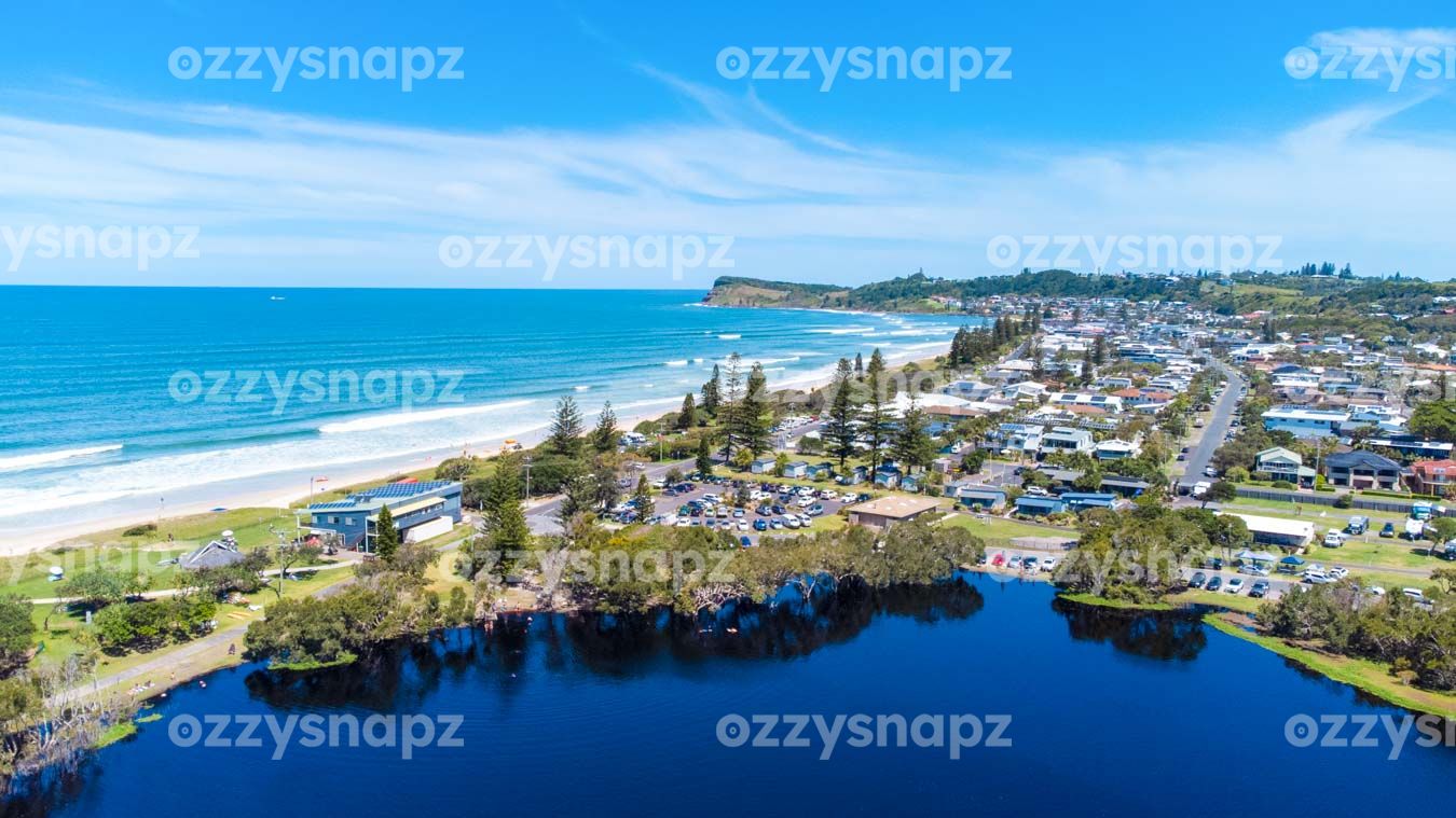 Aerial View of Lennox Head from Lake Ainsworth with Pat Morton Lookout in the Background Experience the stunning natural beauty of Lennox Head from above with this breathtaking aerial photo captured from Lake Ainsworth.