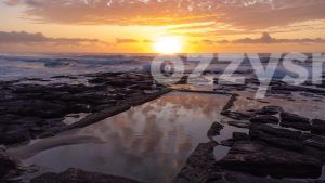 breathtaking aerial drone shot of the Shelly Beach rockpool at sunrise. Captures the wildness of the ocean and the calmness of the rockpool.