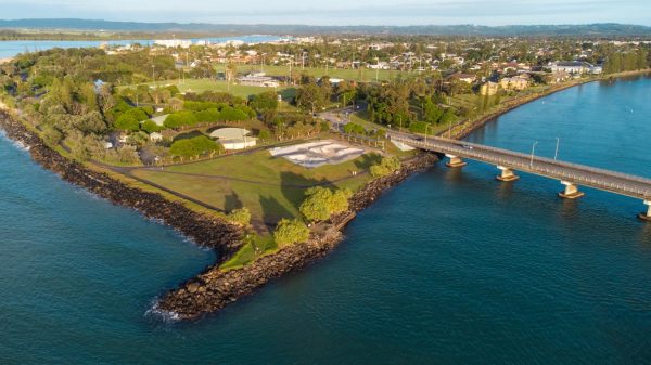 Stunning drone shot of Missingham Park in Ballina at sunrise. North Creek, Richmond River, and lush greenery in a high-quality stock image.
