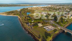 Stunning stock image of Missingham Park in Ballina, with an aerial view of the peaceful Richmond River and charming town in the background.