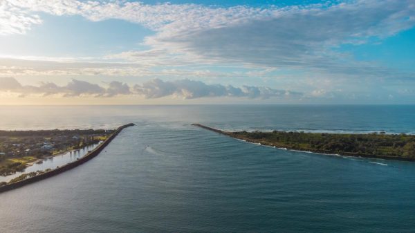 Aerial view stock image of the sunrise at Richmond River's Mouth in Ballina.