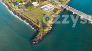 Downloadable stock image of Ballina's Missingham Park with skatepark, bridge, and teal waters