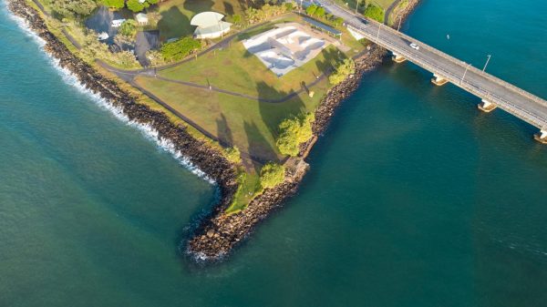Downloadable stock image of Ballina's Missingham Park with skatepark, bridge, and teal waters