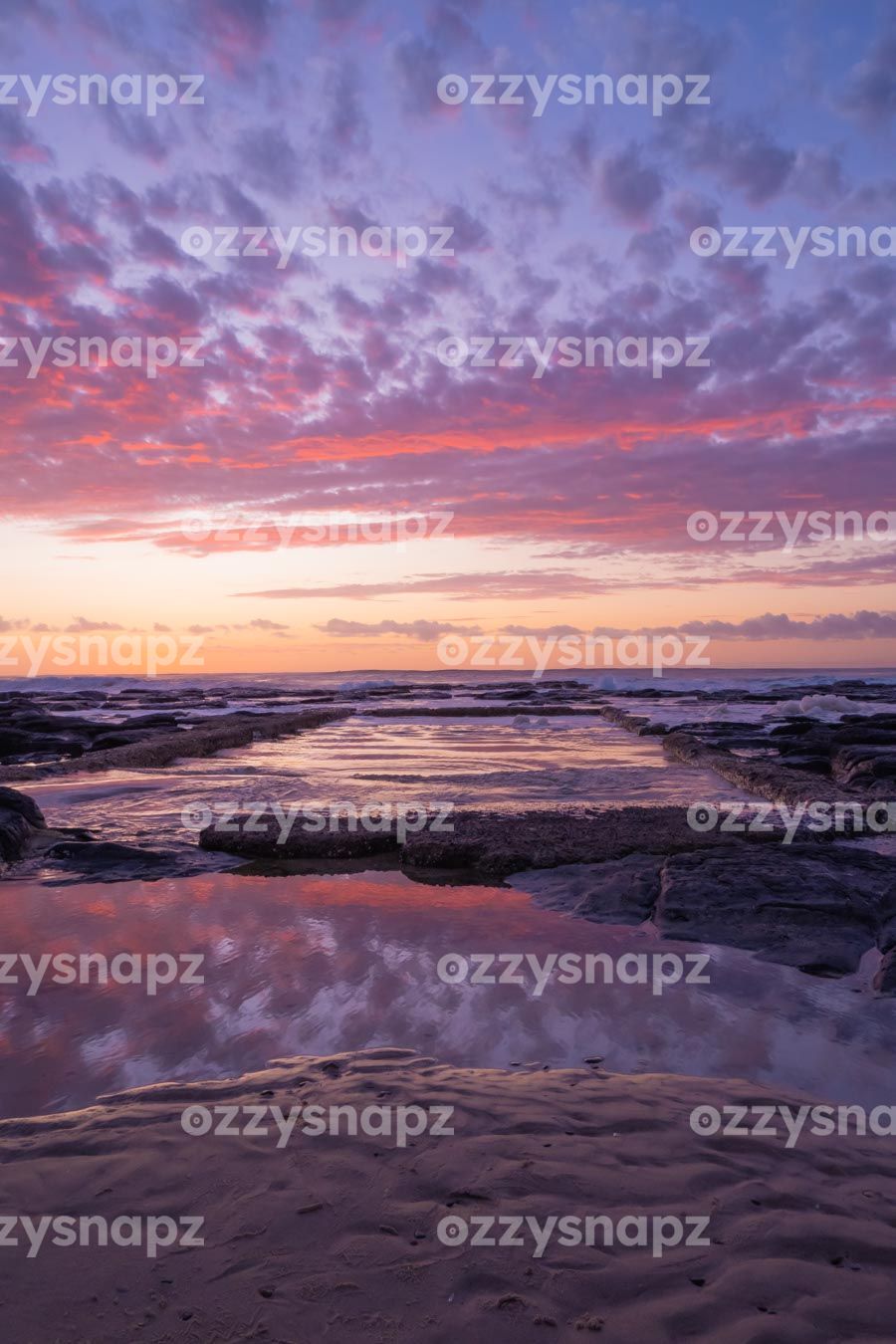 ozzysnapz_221338_low Stunning stock image of sunrise reflections at Shelly Beach rock pool.