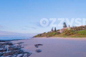 tranquil sunrise at Shelly Beach in East Ballina with the Shelly Beach Cafe nestled among the lush greenery.