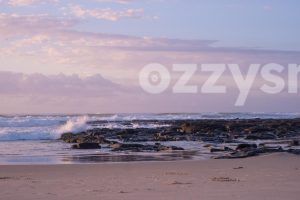 Soothing sound of waves crashing onto the rocks during sunrise at Shelly Beach in East Ballina.