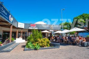 Downloadable stock photo of vibrant Jonson St Byron Bay, showcasing Thai Sabai, Chia, SOS Phone Repairs, and Avocado Hut.