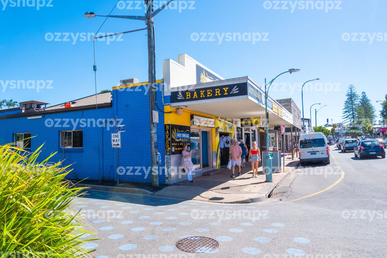ozzysnapz_221396_low Download this colourful stock image of Jonson Street intersection in Byron Bay CBD. Capturing the city life, shops, pedestrians, and traffic.