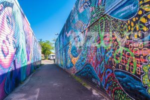 Download this stock image of a colourful graffiti alleyway in the heart of Byron Bay's town centre. Explore Byron Bay's art and culture scene.