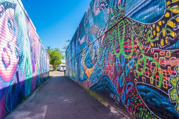 Download this stock image of a colourful graffiti alleyway in the heart of Byron Bay's town centre. Explore Byron Bay's art and culture scene.